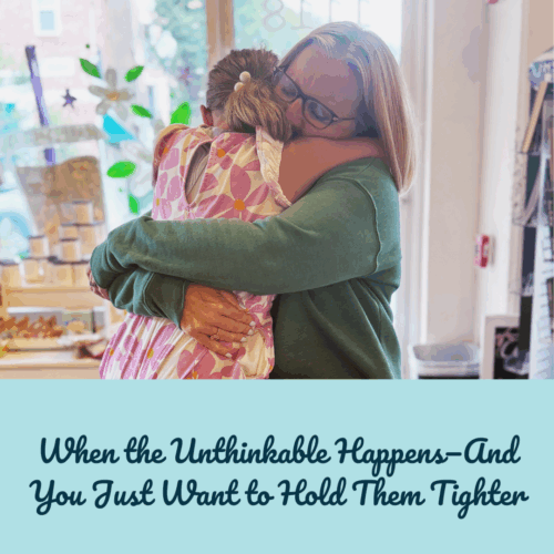Mom holding little girl